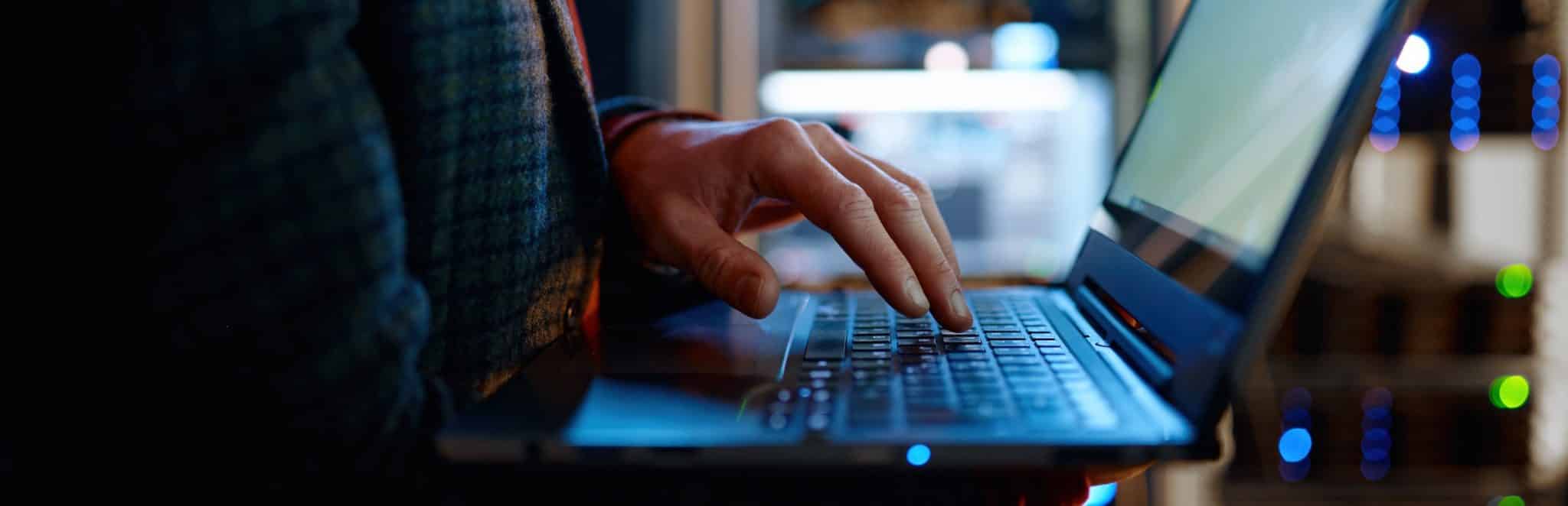 a close up of a person using a laptop computer
